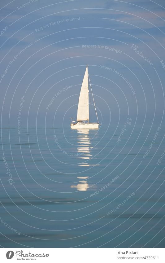A yachts in the sea. beautiful blue boat bright cloud colorful creepy cruise england europe exhalation fishing fog harbor harbour haze holiday horizon horror