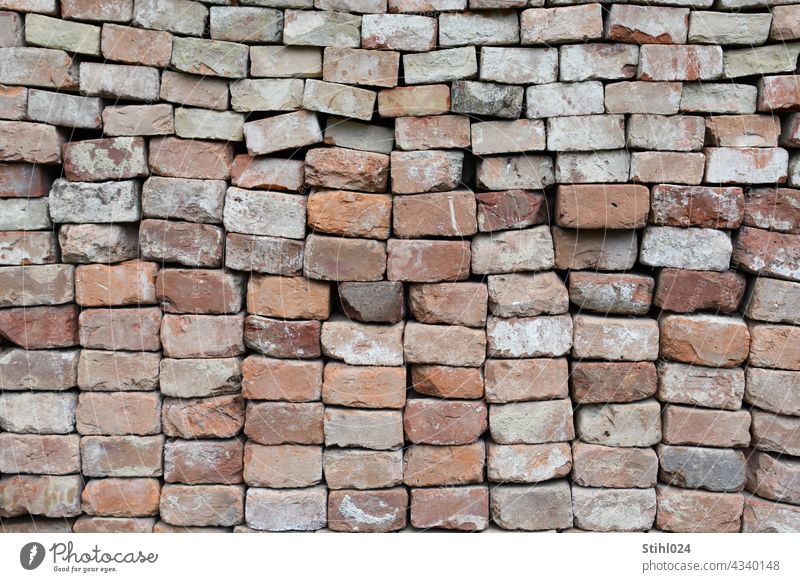 stacked bricks Brick Stack pile full-frame image Wall (barrier) Structures and shapes Pattern Deserted Exterior shot Stone Facade Brick wall Architecture