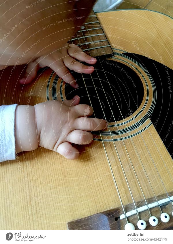 Toddler with guitar Child Baby Guitar sound hole tool Study Curiosity game Hand Fingers play game Children's game Musical instrument string stringed instrument