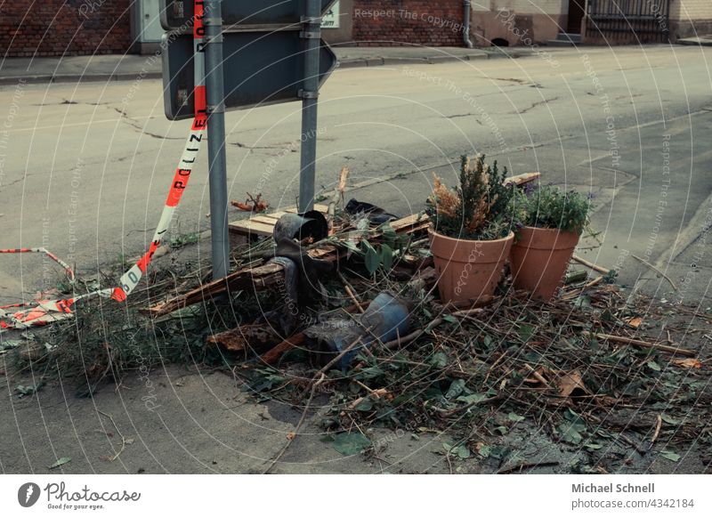 Traces I ...of the flood disaster (July 2021) in Volmetal (Hagen, NRW): Swept up remnants and police cordon tape. Climate change cataclysm Destruction Disaster