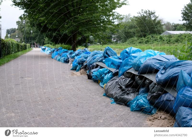 Extreme weather - a line of sand bags in Düsseldorf, Germany climate climate change disaster dusseldorf düsseldorf emergency environment extreme weather flood