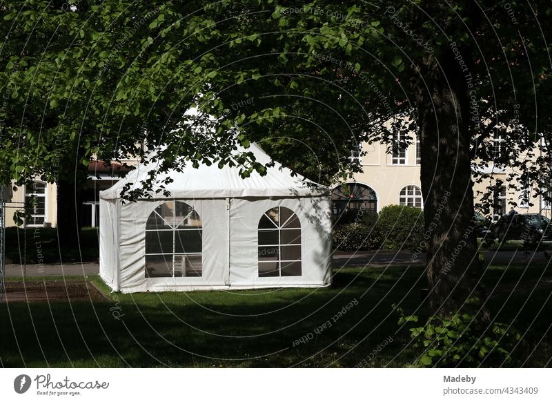 Waterproof party tent in the form of a pavilion in a green park on a company premises in Oerlinghausen near Bielefeld in the Teutoburg Forest in East Westphalia-Lippe