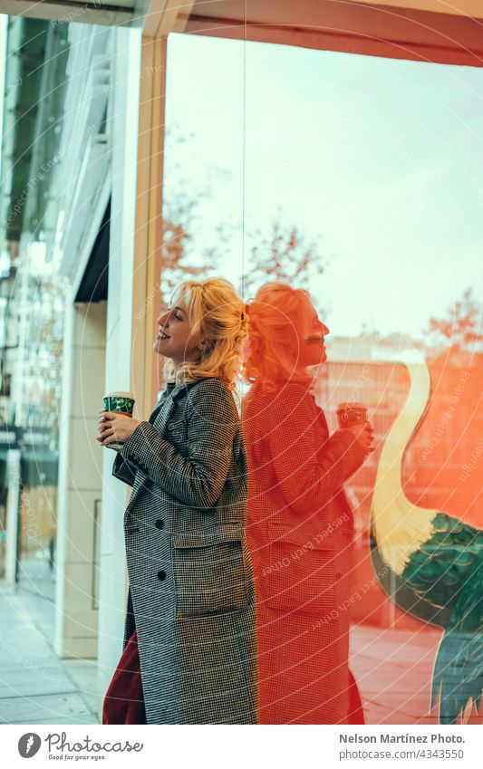 Portrait of a stylish caucasian woman holding a cup of coffee female model breakfast girl city trendy drinking using modern lifestyle lady young portrait urban