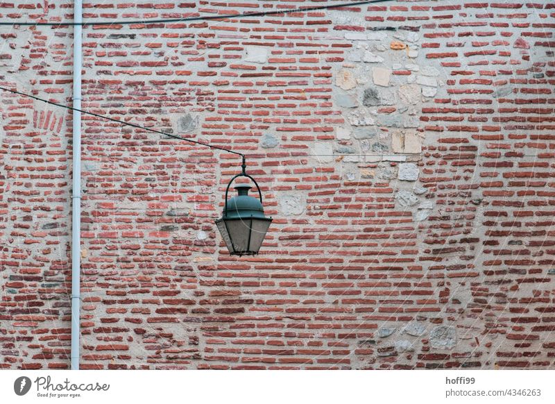 Lamp in front of old brick wall Downspout Street lighting old town charm Old town Brick building red brick clinker facade Decline Fence Wall (building) Gloomy