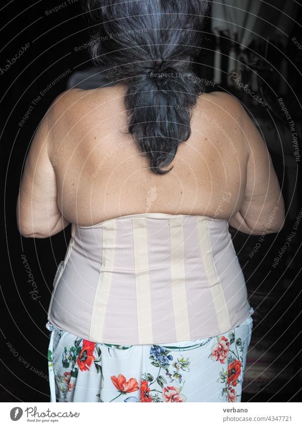woman wearing lombo sacral corrective corset - a Royalty Free
