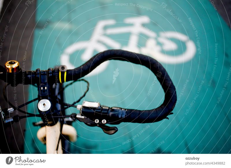 close up handlebar and bicycle lane sign on the street bike summer sport background travel ride transport lifestyle outdoor vintage design old closeup