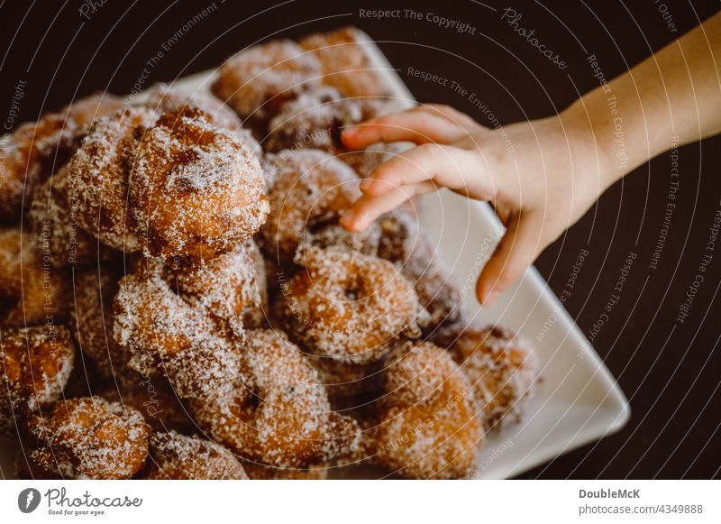 A hand reaches for pancakes | Quarkbällchen | Prilleken | Krapfen | Carnival pastries Pancake Quarkballs Donut Mardi Gras Cookies cute Delicious Food Dessert