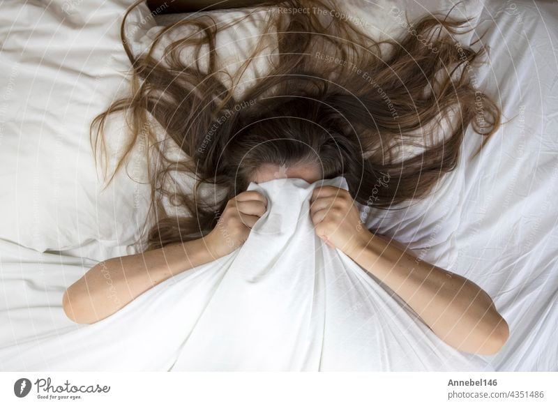 Woman Laying On Bed With Fear And Lower Head, Bruises On Body