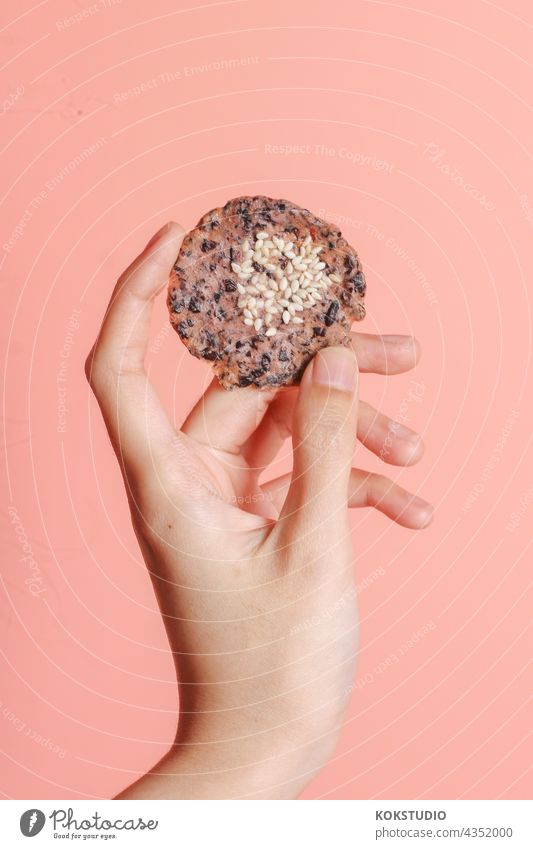 a crispy cookie in woman's hand Cookie Hand Crispy Food Food photograph Snack