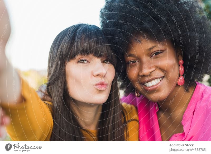 Cheerful lesbian women talking selfie couple lgbt self portrait cheerful relationship unconventional female multiethnic multiracial diverse black