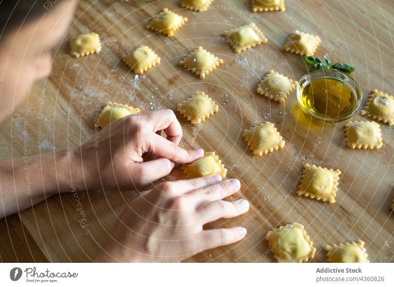 Anonymous Person Preparing Homemade Raviolis food cooking healthy table traditional wooden nutrition closeup pasta board chef cooked cuisine culinary culture