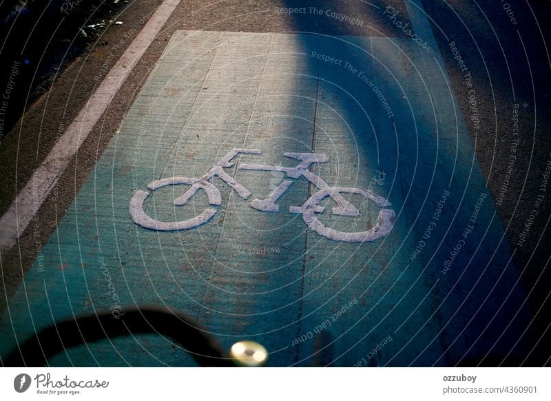 Bicycle road sign on asphalt bicycle lane paint transportation bike symbol city travel path safety traffic route urban white street direction ride way wheel