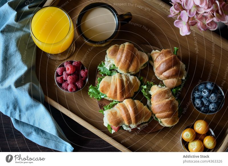 https://www.photocase.com/photos/4363326-appetizing-french-breakfast-with-croissant-sandwiches-on-tray-photocase-stock-photo-large.jpeg