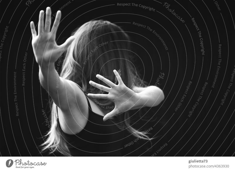 Foto de close-up silhouette of the girl holding breasts of her hands. on a  white background do Stock