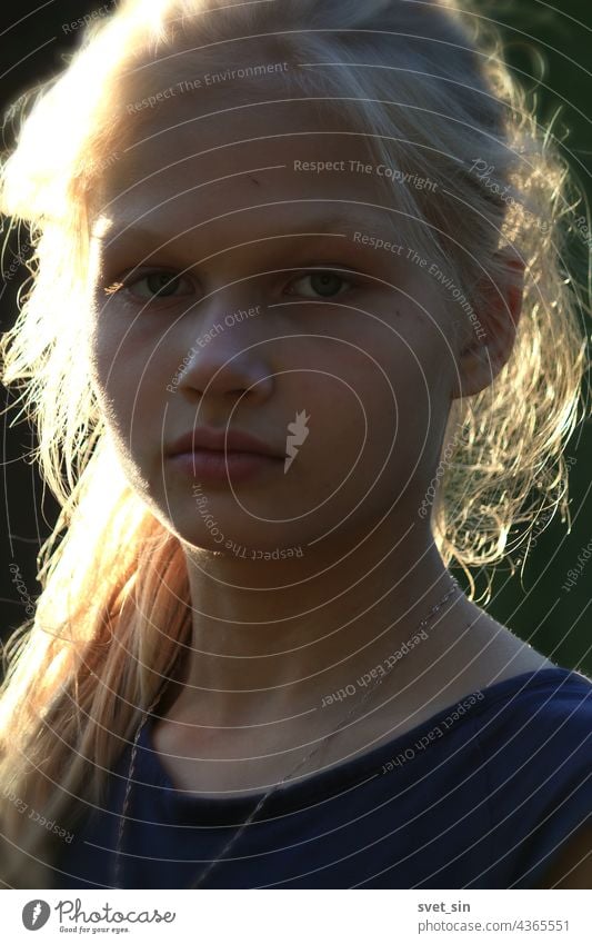 Portrait of a blond girl in the sunlight outdoors. portrait blonde young nice looking beauty summer natural face hair pretty lady cute attractive background