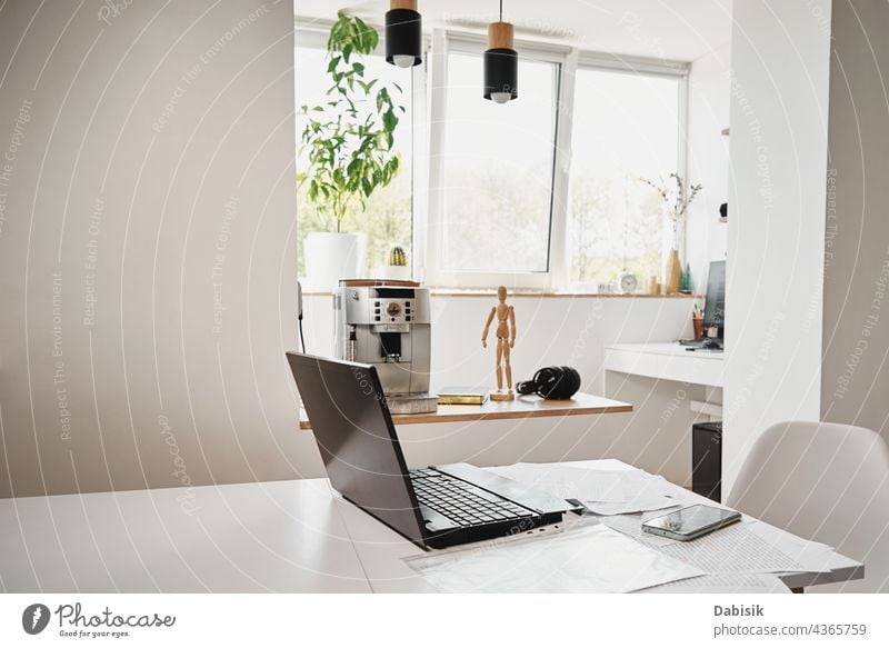 Home office. Laptop on table in the kitchen home interior workplace freelance laptop apartment workspace remote freelancer home office remote work flat worker