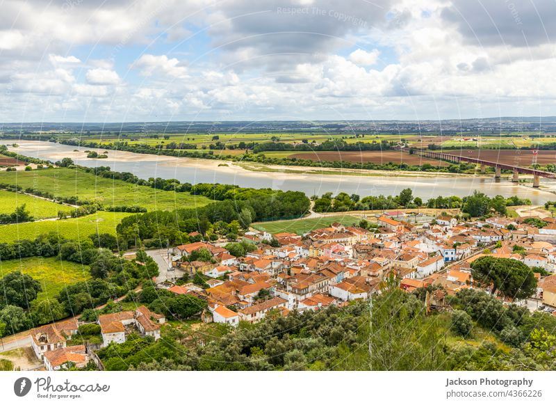 The architecture of Santarem surrounded by green fields and Tagus river, Portugal santarem tagus portugal city bridge town view summer bento building buildings