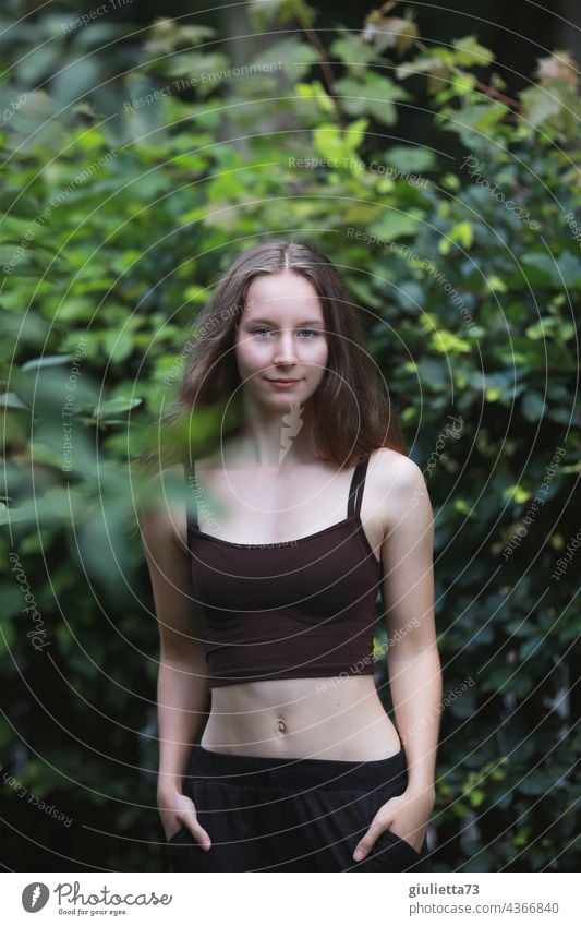 Summer portrait of slim teen girl with belly top in nature Cool (slang) Hip & trendy Smiling Optimism Contentment naturally Central perspective Identity Future