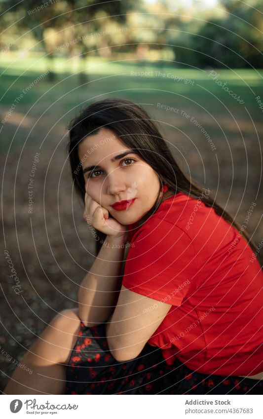 Peaceful woman sitting on bench in summer park - a Royalty Free Stock ...