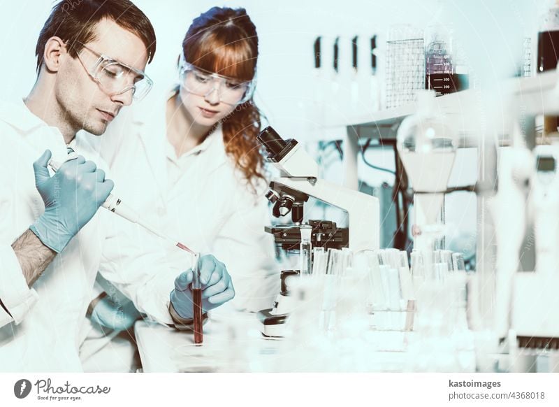Health care students working in scientific laboratory. science research analysis scientist study supervisor team technician technology test tube workspace