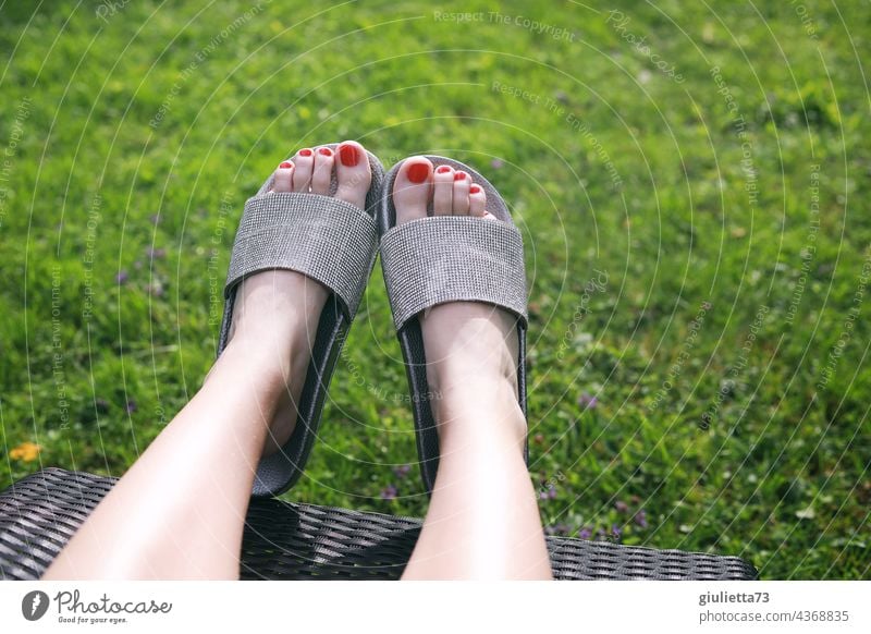 End of work, relaxing feet, sexy woman legs in black nylons on couch - a  Royalty Free Stock Photo from Photocase