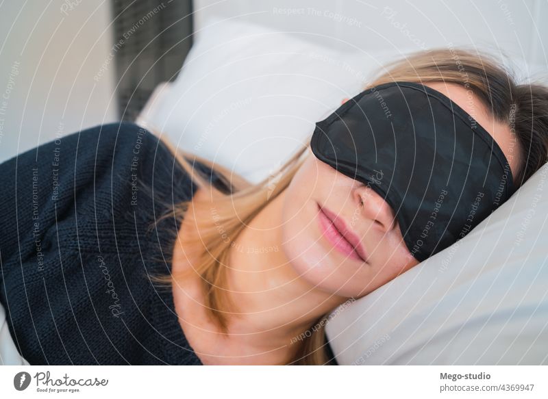 Sleepy Woman With Blindfolds On Eyes Stretching Stock Photo