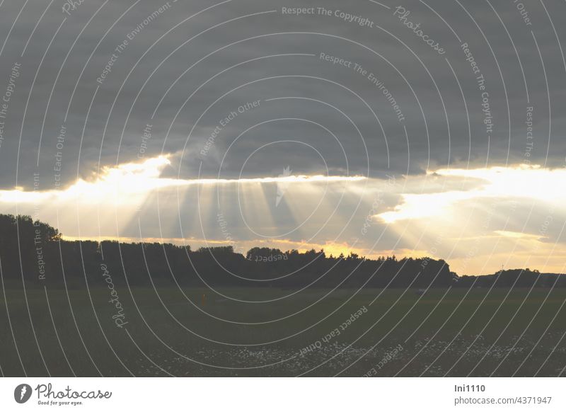 Spaces l in the evening sky natural spectacle Weather dramatic sky Evening evening stroll Sky Clouds weather front somber Cloud cover Dark clouds Light rays