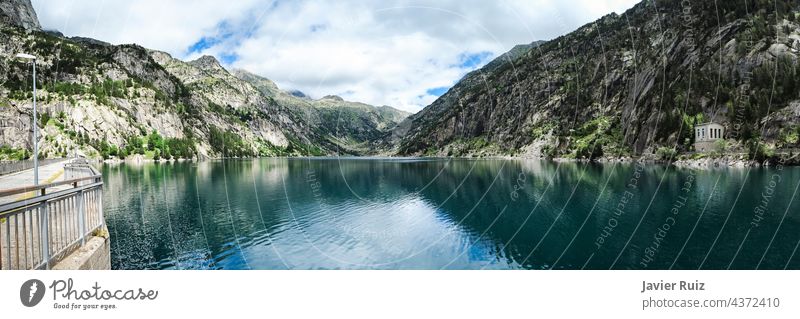 panoramic view of the Cavallers reservoir surrounded by high mountains, river Noguera de Tor in Ribagorza, Boí valley, Pyrenees lake Taull pyrenees Lleida