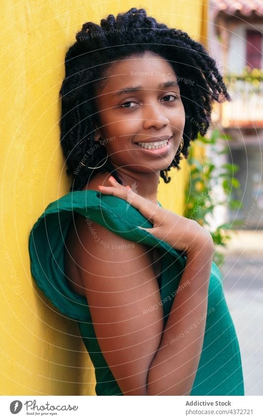 Close upside portrait of beautiful smiling young Black woman lea laughing african people happy american model lady ethnicity afro outside leaning person