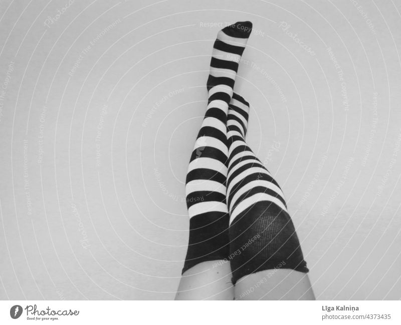 Legs in striped socks in black and white Socks Feet Stand Stockings Striped socks Human being Black & white photo body part Footwear feet toe socks Toes Fashion