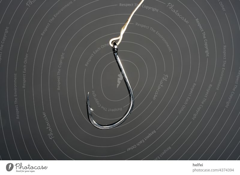 Steel fishhook against dark background Fishing hooks Fishing (Angle) Checkmark Simple angel Abstract Accuracy Spoon bait Bait Catch Leisure and hobbies