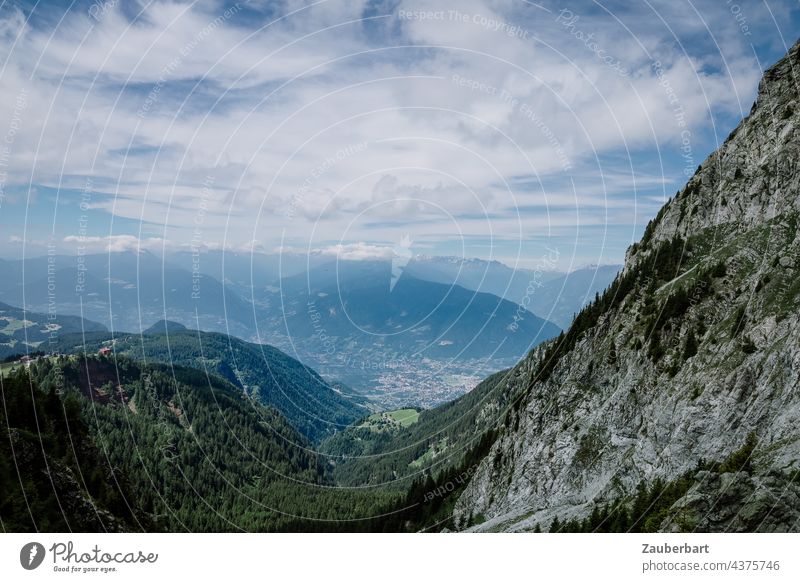 View from the ascent of the Ifinger over rugged rocks into the valley in the South Tyrolean Alps Looking Valley curt Rock Sky Clouds farsightedness Peak