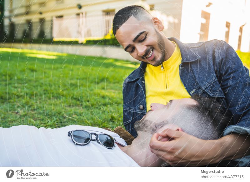 Gay couple spending time together at the park. gay love relationship resting date lovely partnership positive relax freedom life young pride nature dating