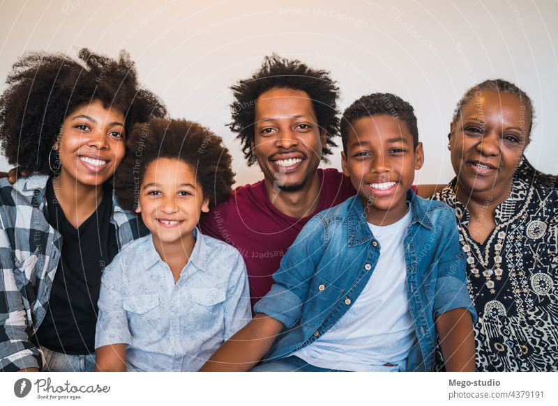 Portrait of multigenerational family at home. smile cheerful portrait together happy love memories five grandmother black son lifestyle photo american woman joy