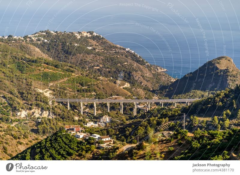 Beautiful landscape of Andalusian coast in La Herradura, Spain spain andalusia mountain hills highway orchard summer green residential architecture mountains