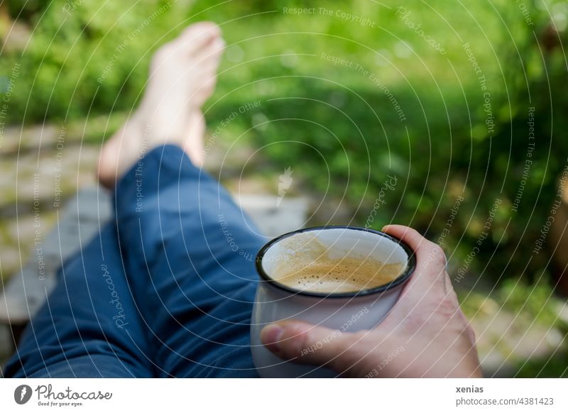 Spaces / taking a break with coffee in hand and feet on the stool between all the green Break Coffee Coffee mug To have a coffee Cup Hand Garden Green Pants