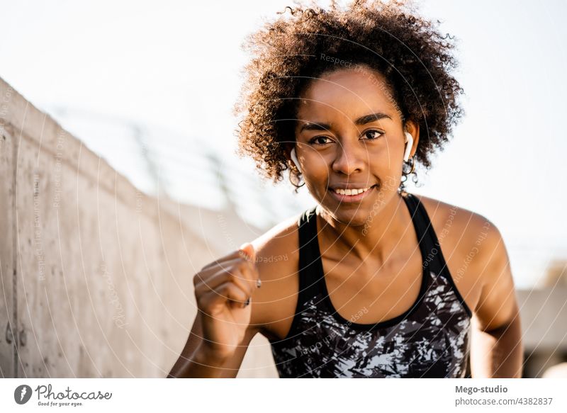 Afro athlete woman running outdoors. sport exercise training runner background people care leisure body portrait sports action motion cardio exercising