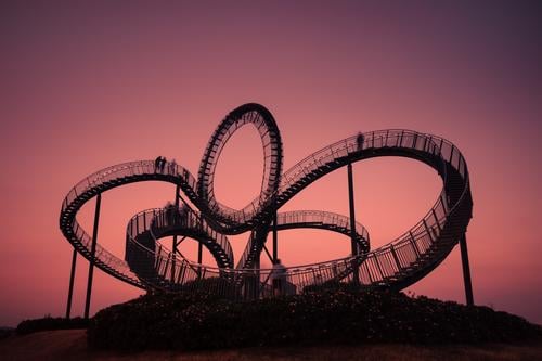 Curved steel staircase in front of red evening sky, long exposure Tiger and Turtle Work of art Stairs Steel Metal Arch curvy Round evening mood Construction