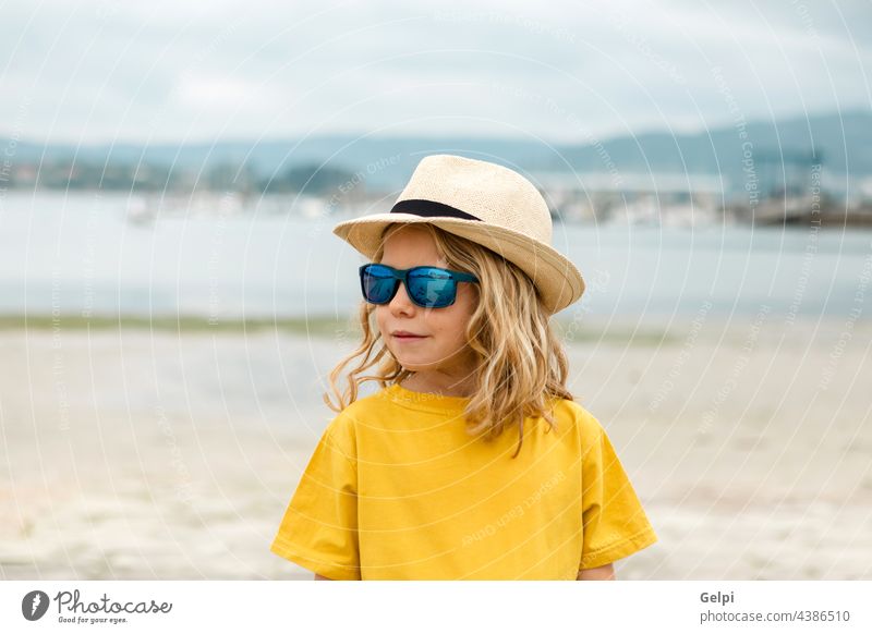 Happy child having fun on summer vacation sun blue holiday beach beautiful sea travel dream enjoy freedom imagination kid relax happiness yellow person