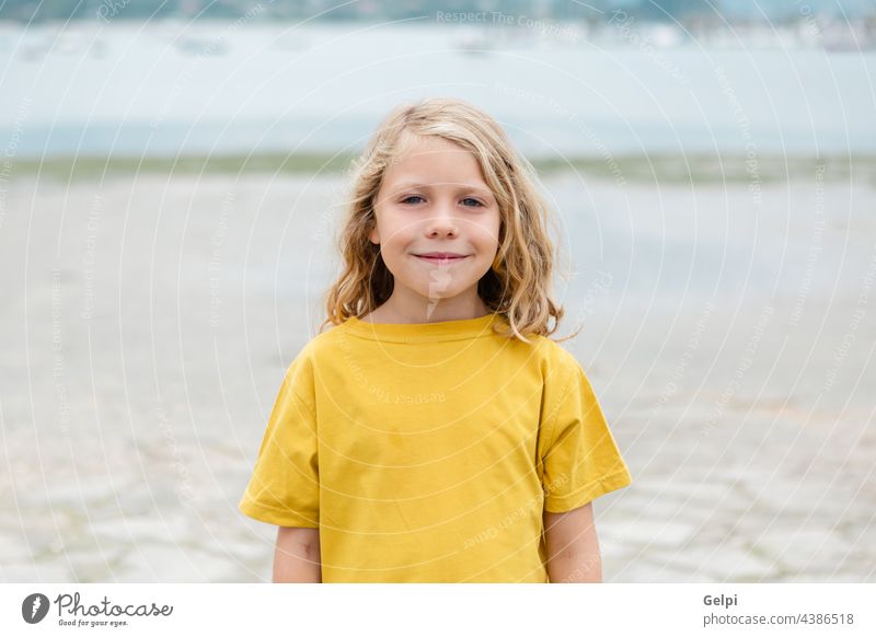 Happy child having fun on summer vacation sun blue holiday beach beautiful sea travel dream enjoy freedom imagination kid relax happiness yellow person