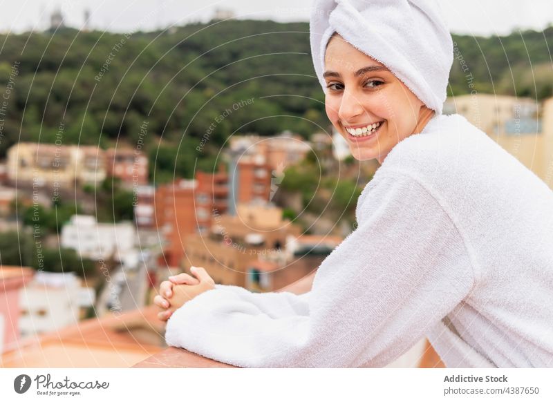 Cheerful female resting on balcony after shower - a Royalty Free Stock  Photo from Photocase