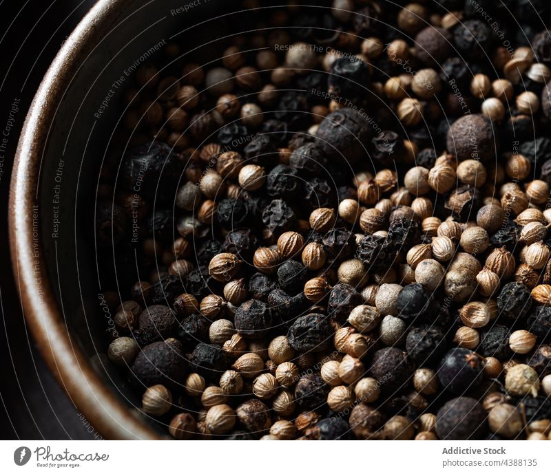 Closeup of a pile of peppercorns viewed from above spice isolated seed white spicy ingredient cooking grain background food dry black heap closeup organic