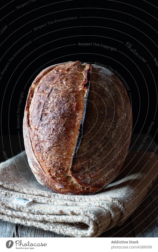 Homemade sourdough loaf in black background bread baked fresh food rye healthy organic grain delicious traditional homemade soft flour tasty appetizer breakfast