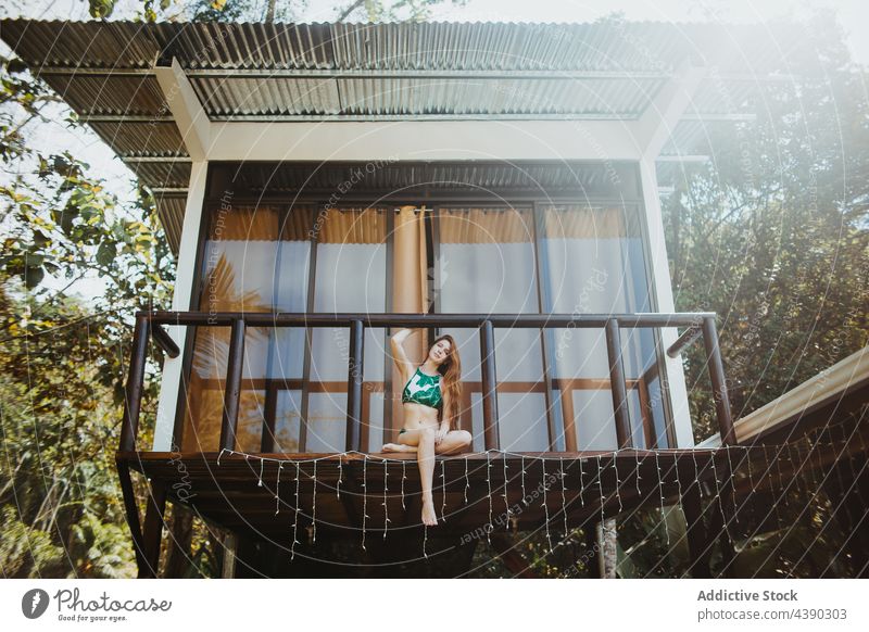 Young woman with beautiful body in a beach hut - a Royalty Free Stock Photo  from Photocase