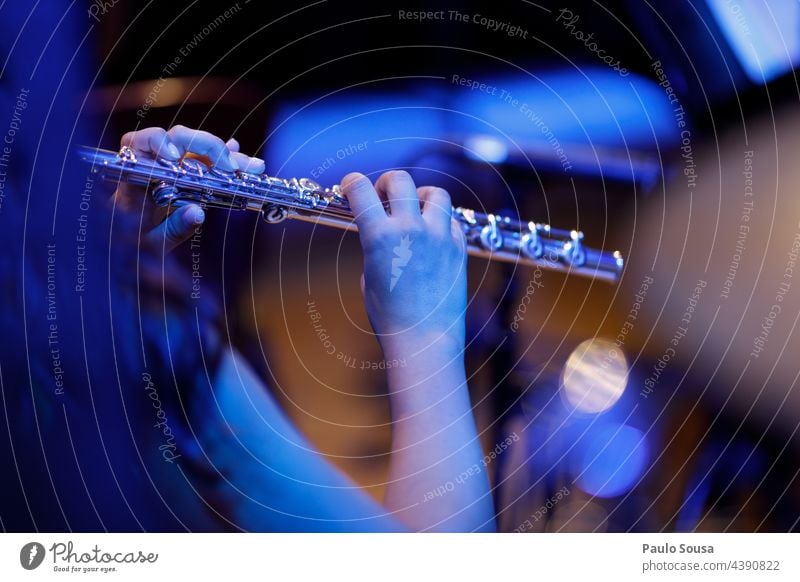 Woman playing flute Flute Flute-player Music Musician Musical instrument Orchestra skill Concentrate Colour photo Leisure and hobbies Close-up Interior shot