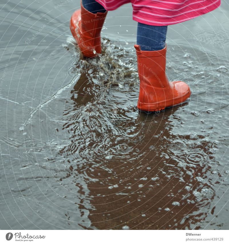 water features Happy Playing Aquatics Parenting Kindergarten Child Schoolchild Girl Legs Feet 1 Human being 3 - 8 years Infancy Bad weather Rain Street Dress