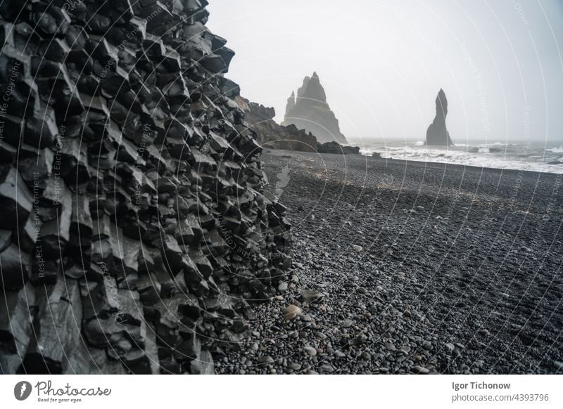 Basalt columns and pebble black beach on stormy day in Iceland travel rock ocean nature coast water landscape sea iceland sand volcanic shore outdoor icelandic