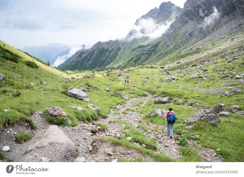 Hiking in the mountains Alps trekking Fog off Pass Backpack tour holidays Bavaria Kleinwalsertal