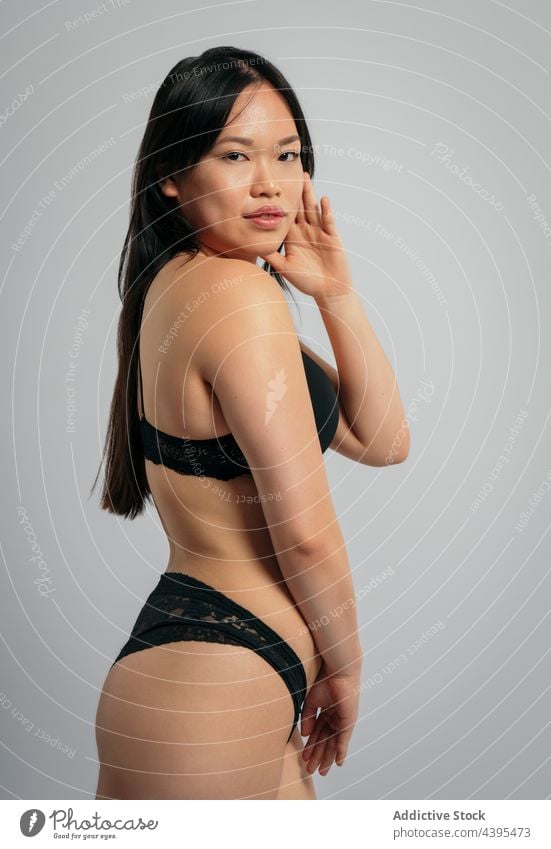 Overweight ethnic woman in lingerie in studio - a Royalty Free