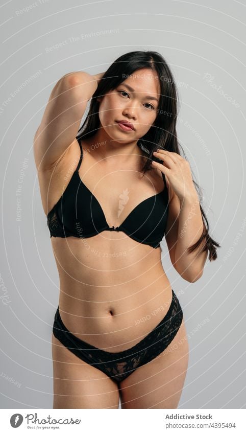 Overweight ethnic woman in lingerie in studio - a Royalty Free